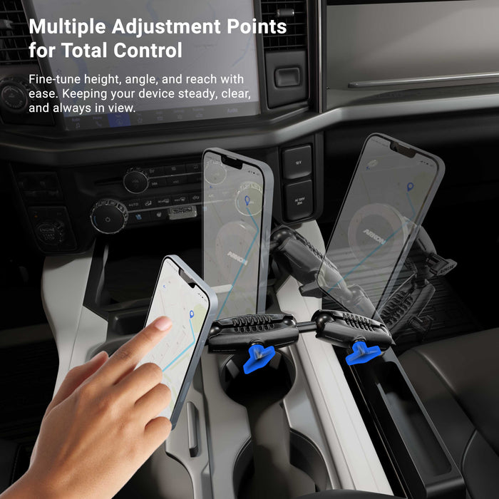 A hand adjusts the Magnetic Holder with Seat Wedge Mount and Dual Shaft Arm - MagSafe Compatible, which is mounted in the car and demonstrates its multiple adjustment points. The interior of the vehicle, digital maps displayed on phone screens, and movement from making adjustments are visible.