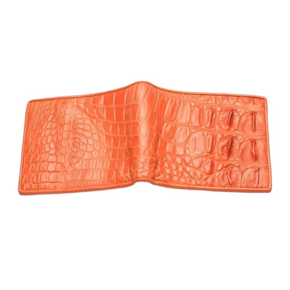 The men's orange crocodile wallet laid open and flat, showing the full length of the authentic backbone skin exterior.