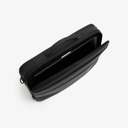 Carbon Black (Vegan Leather) | Angled view of open interior view of Metro Briefcase in Carbon Black showing the padded laptop compartment