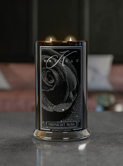 lit midnight rose candle jar on counter