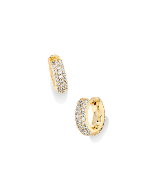 Gold hoop earrings with embedded crystals on a white background