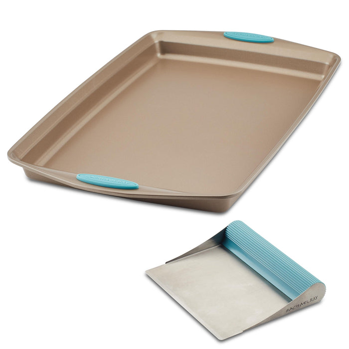 Nonstick baking sheet and bench scrape set featuring blue silicone grips.