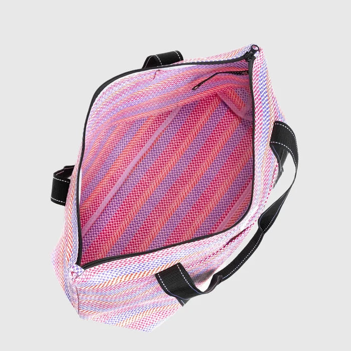 Mesh backpack with pink and purple striped pattern on a light gray background