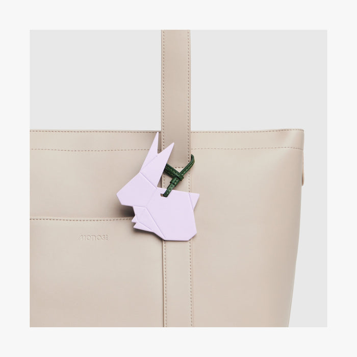 Purple Icing | Close-up view of the Origami Rabbit Charm attached to a Tote bag