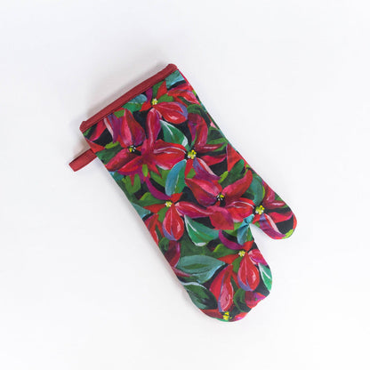 A floral oven mitt with red and green poinsettias on a white background, with a visible red loop on the back for hanging.