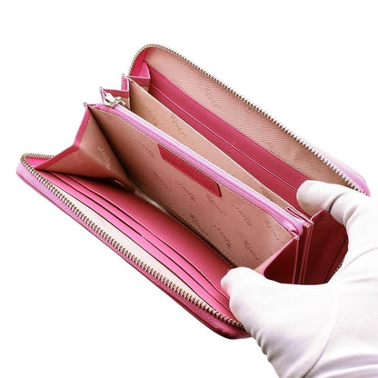 The spacious interior of the long zip-around wallet, showing card slots and the center zip pocket.