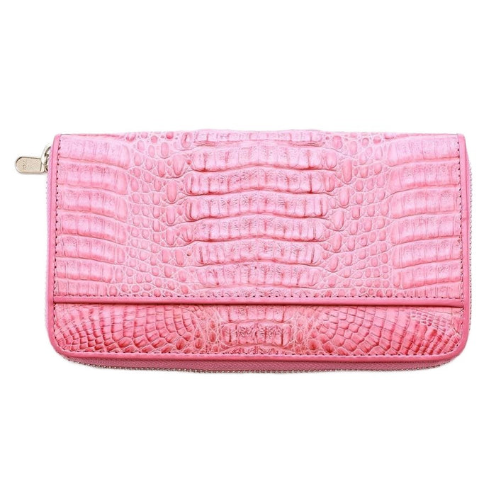 The pink crocodile wallet open, showing it is large enough to be a passport holder.