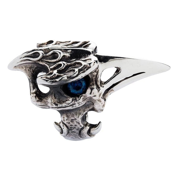 A profile view of the heavy silver raven ring, showing the long, polished beak and textured bone.