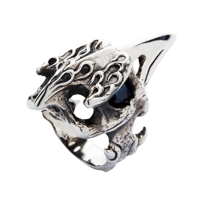 Detail of the handcrafted rustic and flame textures on the sterling silver raven skull ring.