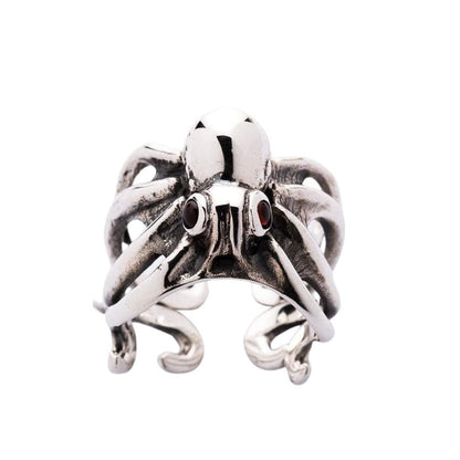 Gothic style sterling silver octopus ring front face with dual red garnet eyes