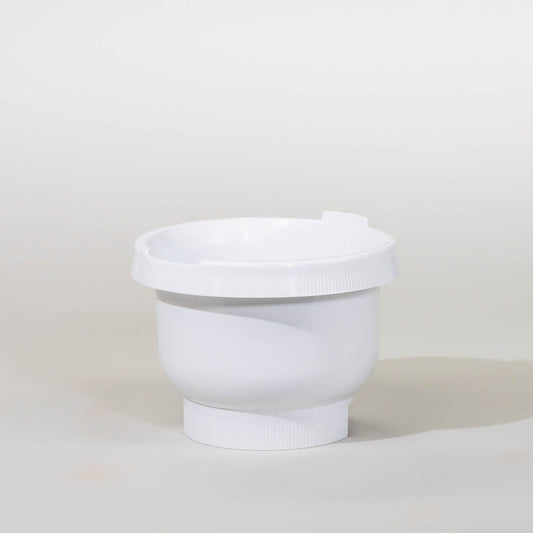 Bosch compact mixer white plastic bowl with lid on a grey background