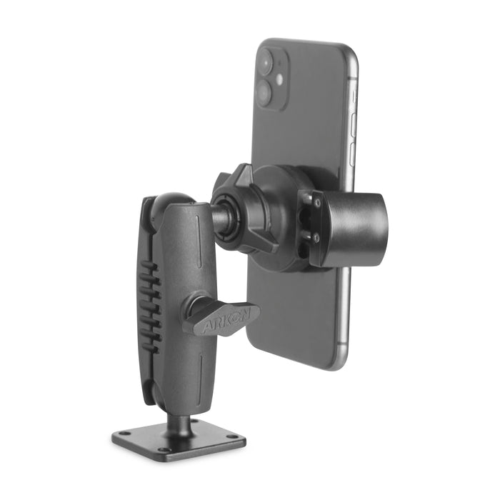The RoadVise® Phone Holder with Drill-Base Mount securely holds a smartphone vertically with its black adjustable design. Featuring an AMPS pattern, the mount attaches to a flat base using a jointed arm for secure and stable positioning.