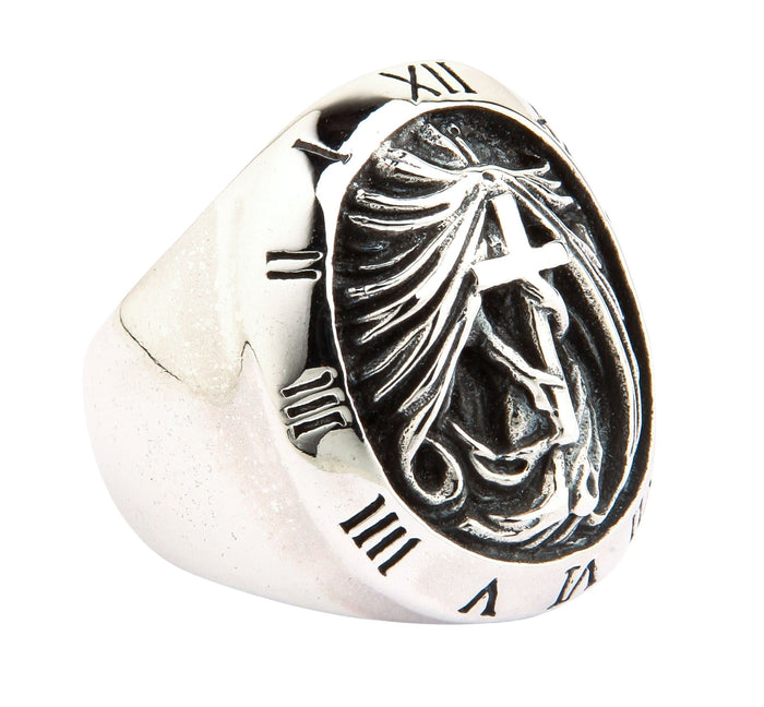 An angled view of the sterling silver gothic cross ring, highlighting the Roman numeral bezel.