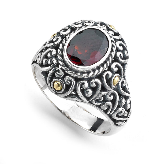 Samuel B. Sterling Silver and 18K Yellow Gold Balinese Design Oval Garnet Justina Ring, Size 7. Our Sterling Silver 18k solid Gold 7x9 oval cut garnet ring, handcrafted in Bali by our skilled artisans. From our signature collection, Royal Bali™ featuring designs handcrafted using sterling silver, solid 18k gold accents and genuine gemstones.