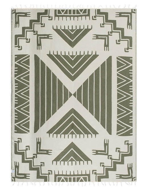 Geometric patterned blanket with green and beige design on a white background