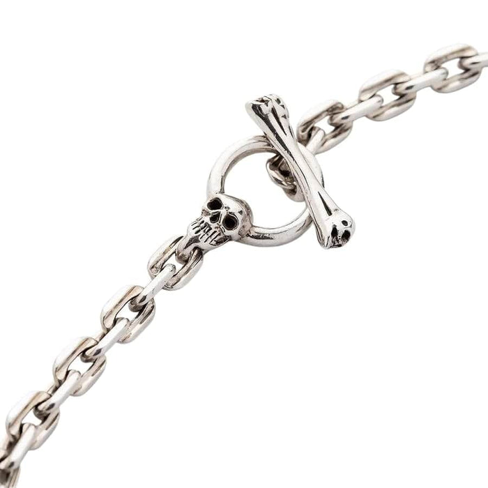 The skull toggle clasp shown fastened, demonstrating its secure T-bar mechanism.