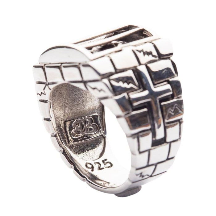 The inside of the heavy and solid caged skull ring, showing the .925 sterling silver hallmark stamp and intricate branding.