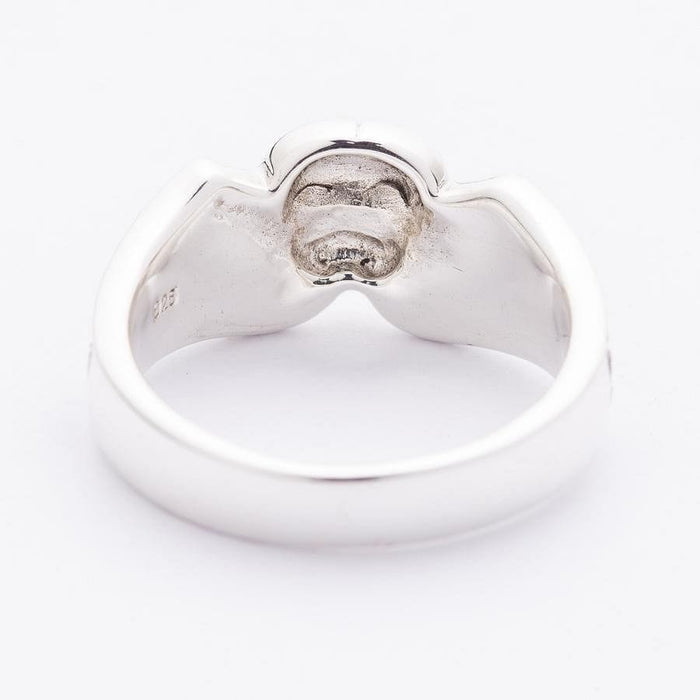 Rear of the skull band showing the polished inner shank and the matte hollow beneath the top setting.