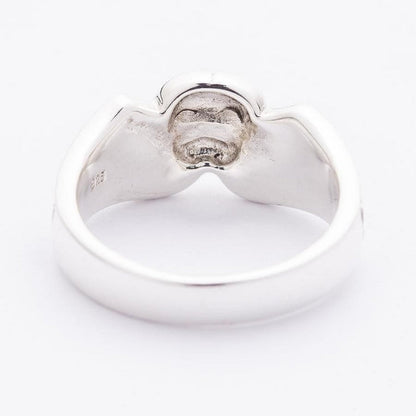 Rear of the skull band showing the polished inner shank and the matte hollow beneath the top setting.