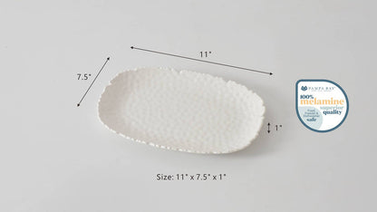 White ceramic platter with dimensions and a quality assurance label on a gray background