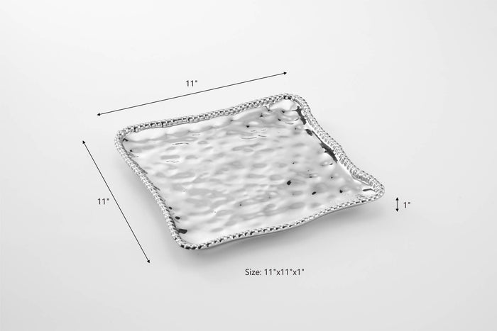 Rectangular ceramic tray with textured surface and measurements on a white background
