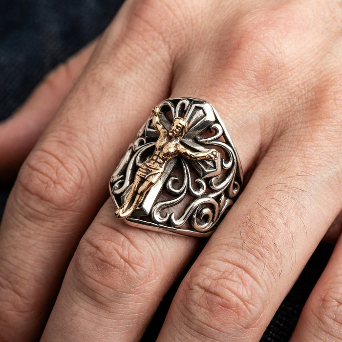 Mens sterling silver crucifix ring with bronze Jesus worn on middle finger showing full face and filigree pattern