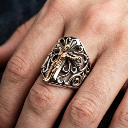 Mens sterling silver crucifix ring with bronze Jesus worn on middle finger showing full face and filigree pattern