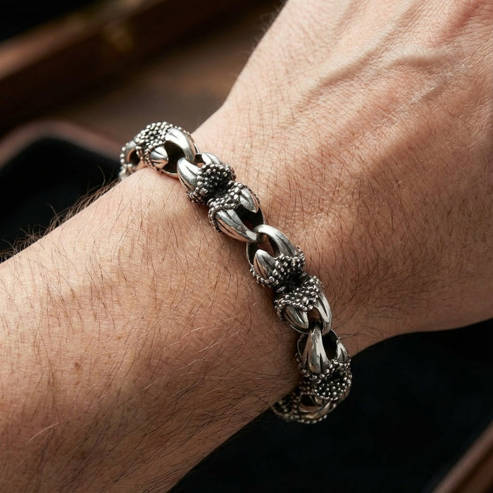 Men's gothic eagle talon sterling silver bracelet worn on wrist showing detailed claw links