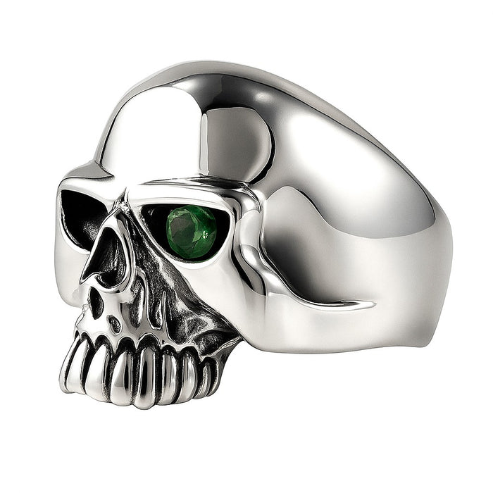 A shot of the men's emerald skull ring on a white background, highlighting the green CZ stone.