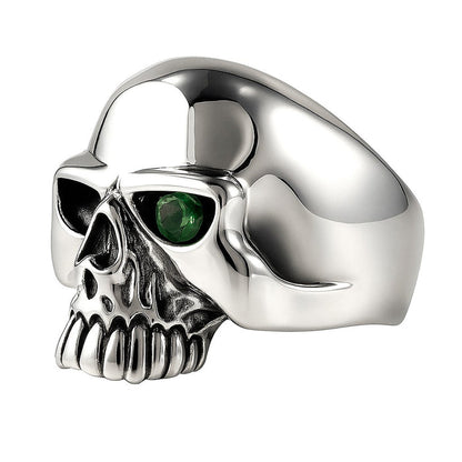 A shot of the men's emerald skull ring on a white background, highlighting the green CZ stone.