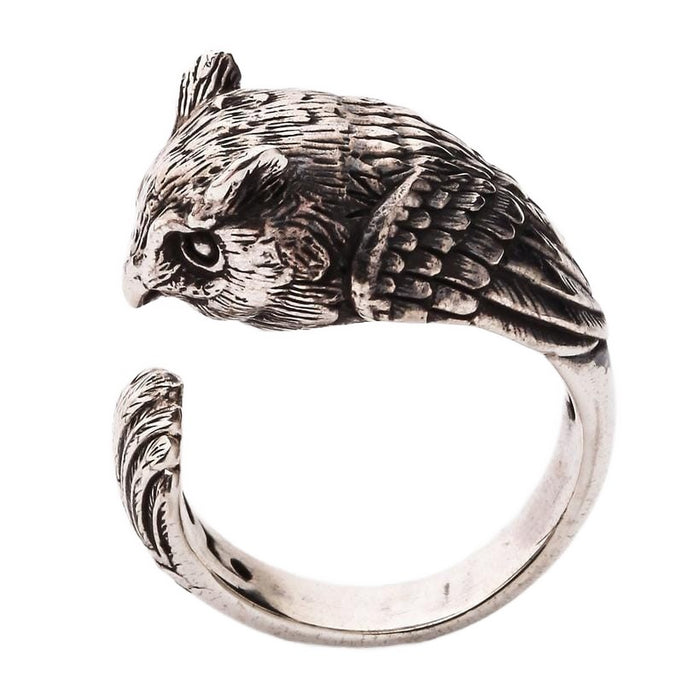 A side profile of the silver owl ring, showing the solid band and feather texture.