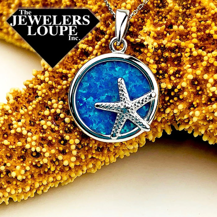 Sterling Silver Round Blue Inlay Created Opal with Small Silver Starfish Pendant on 18" Sterling Silver Chain.
