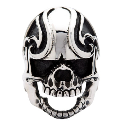 Direct front view focusing on the carved spade silhouette on the forehead of the solid silver skull ring.