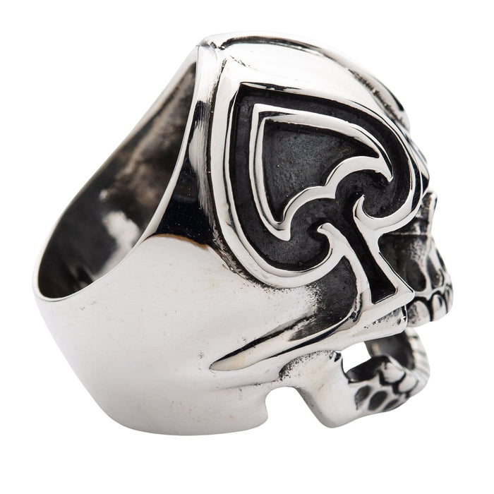 Top-down perspective showing the deep spade carving on the skull's forehead blending into the smooth silver ring band.