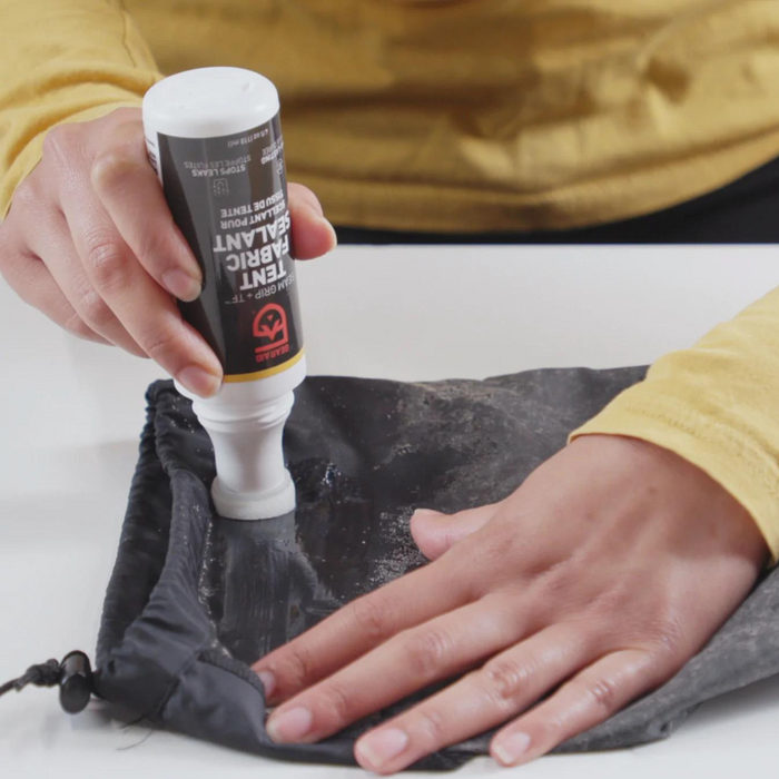 Restore your tent or coated fabrics in a snap with this easy Gear Aid Sealant.  This clear sealant makes tent waterproofing hassle-free with its built-in foam applicator brush. Over time, the protective waterproofing on a tent floor, rain fly, or tarp wears out and begins to flake off.  When a rainfly gets sticky or backpacks start delaminating, make them perform again with Seam Grip TF Tent Fabric Sealant.