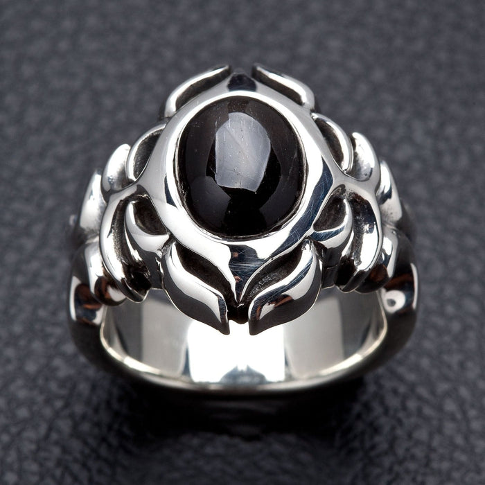 Front face of the Tribal Black Onyx ring showing the oval cabochon stone framed by polished sterling silver tribal carving