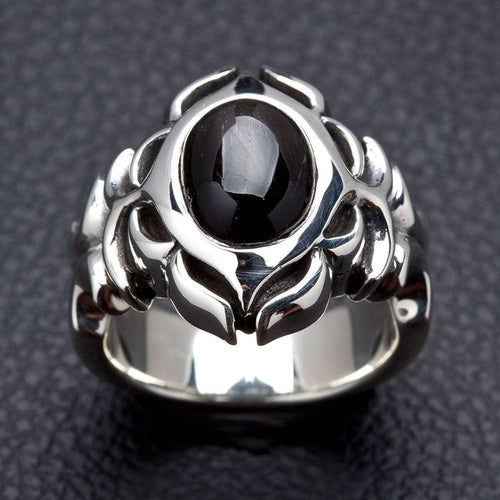 Front face of the Tribal Black Onyx ring showing the oval cabochon stone framed by polished sterling silver tribal carving