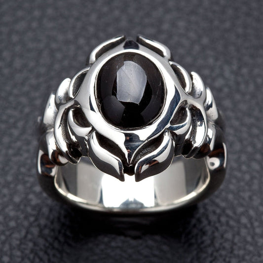 Front face of the Tribal Black Onyx ring showing the oval cabochon stone framed by polished sterling silver tribal carving