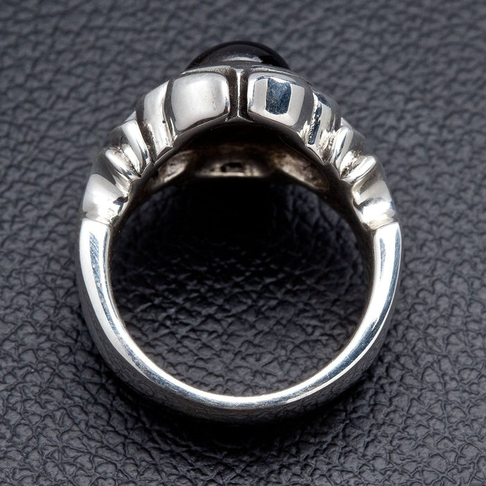 Rear view of the ring revealing the open shank and the ribbed underside of the raised black onyx setting in sterling silver