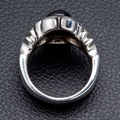 Rear view of the ring revealing the open shank and the ribbed underside of the raised black onyx setting in sterling silver