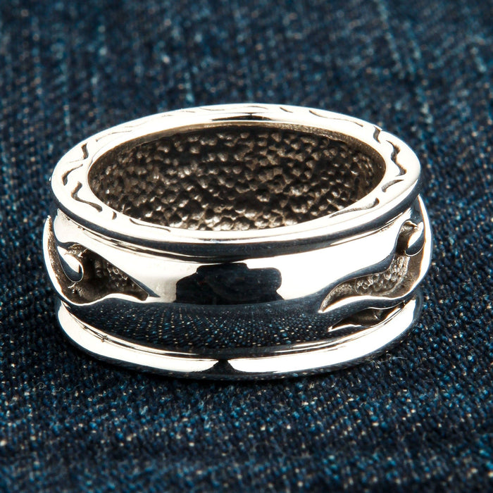 A macro shot of the inside of the tribal ring, showing the unique hammered comfort fit texture.