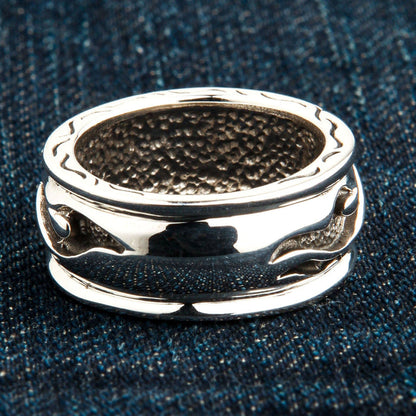 A macro shot of the inside of the tribal ring, showing the unique hammered comfort fit texture.