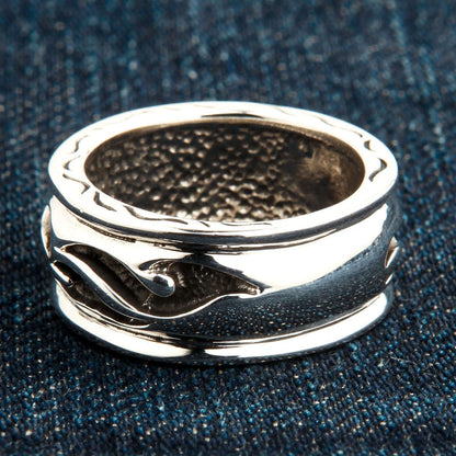 Side profile of tribal design sterling silver men’s band ring showing pattern depth