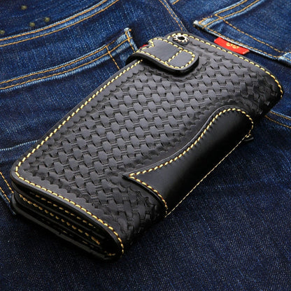 Basketweave panel framed by smooth black leather, thick yellow stitching and a metal snap on the strap.