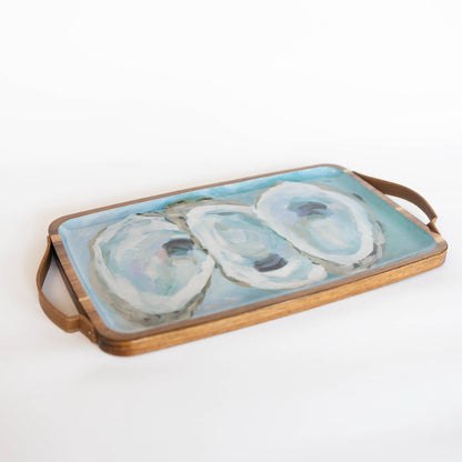 Wooden tray with oyster pattern against white background