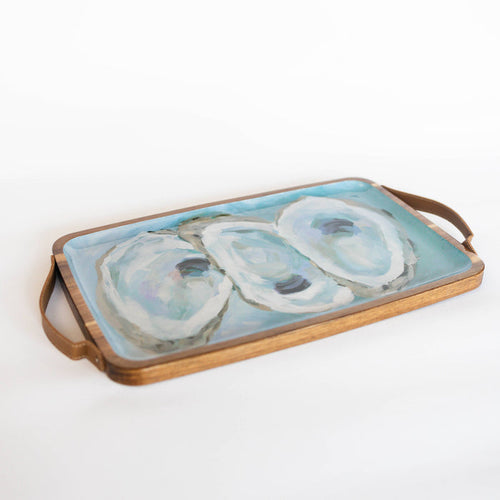 Wooden tray with oyster pattern against white background