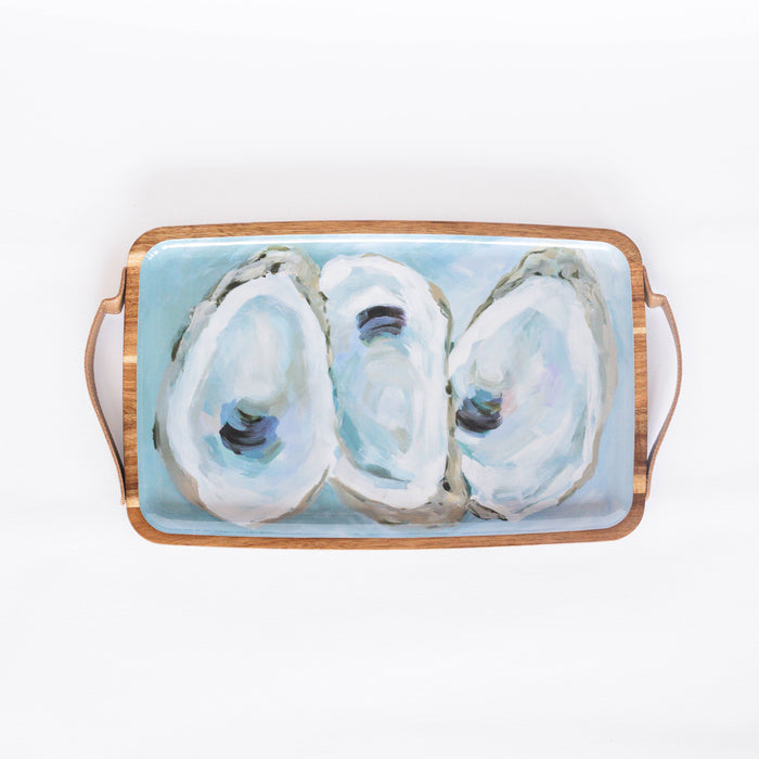 wooden tray with oyster pattern against white background