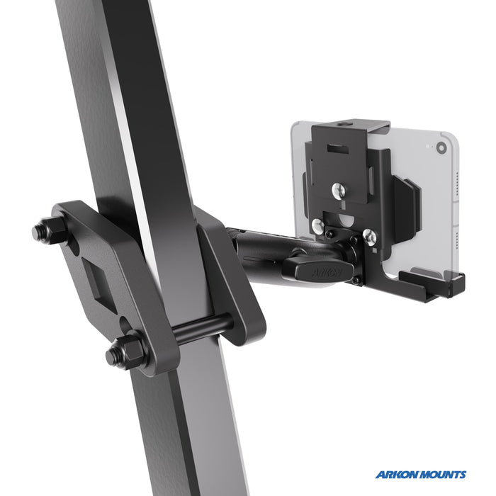 The XMS™ Heavy Duty Forklift Mount with LockVise™ Metal Locking Tablet Holder is securely attached to a thick metal beam, holding a smartphone horizontally. The Arkon Mounts logo appears in the bottom right corner, highlighting its reliability as part of an industrial tablet mounting system.