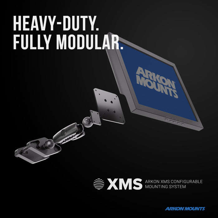 A modular mounting system with labeled parts is shown attaching a screen reading XMS™ Heavy Duty Forklift Mount with VESA Adapter Plate. Designed for material handling environments, the text says HEAVY-DUTY. FULLY MODULAR. and XMS Arkon XMS Configurable Mounting System, featuring a VESA adapter plate for added versatility.