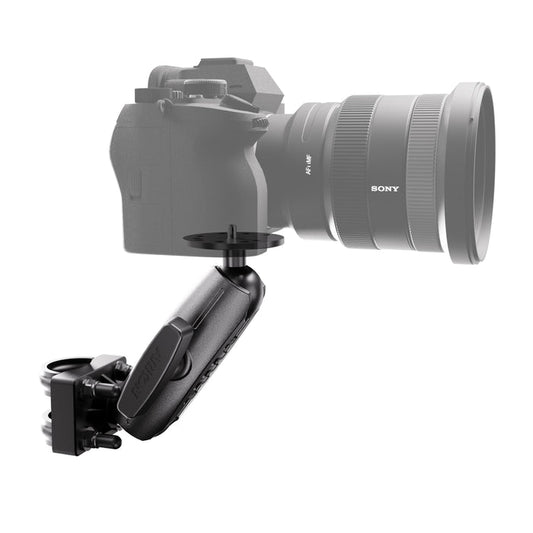 An XMS™ U-Bolt Mount with Camera Pedestal, finished in black and built for heavy-duty use, is attached to the bottom of a camera with a large lens. The mount includes adjustable joints for flexible angling and positioning. Both the camera and lens are shown as partially transparent.